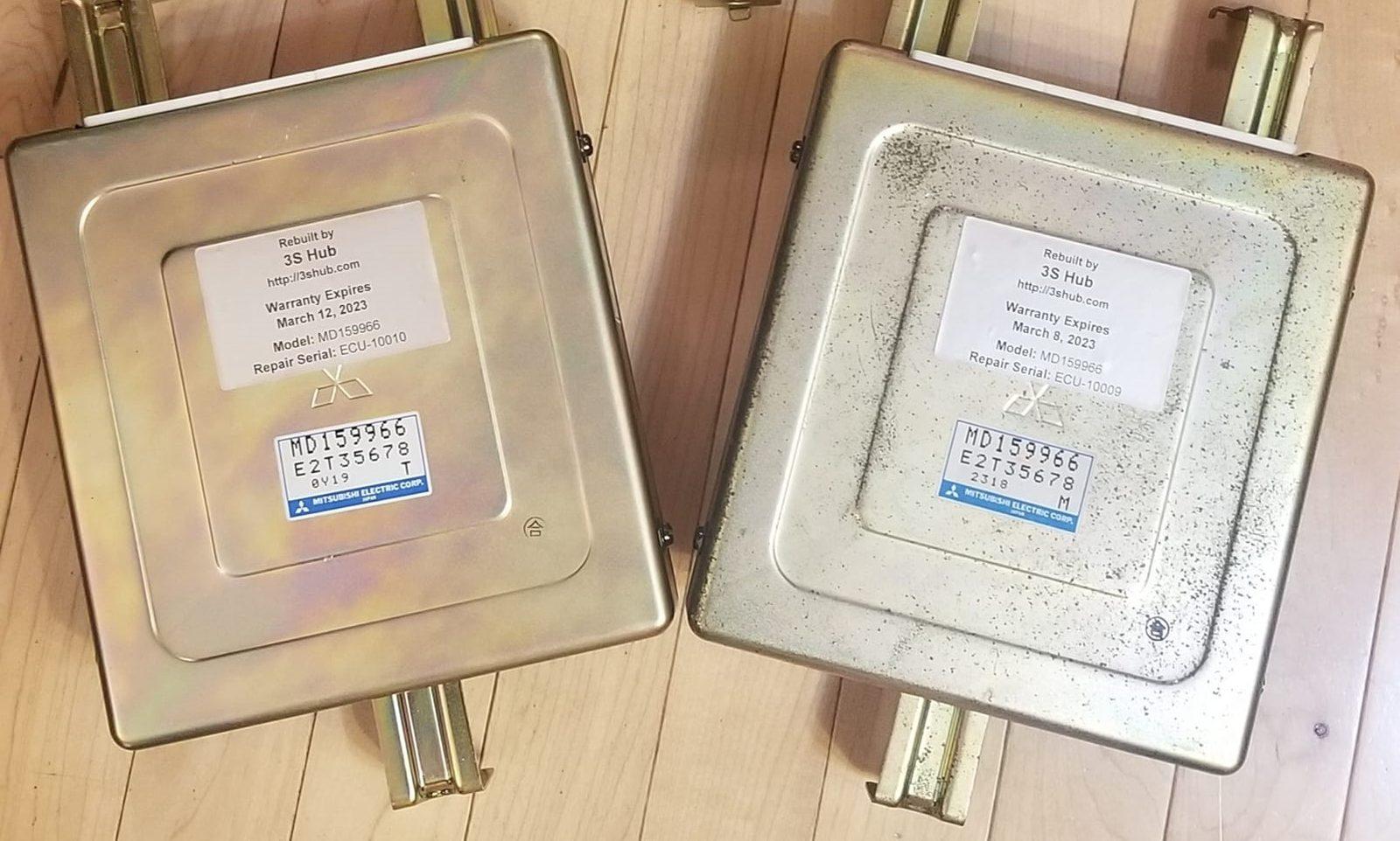 Two rebuilt engine computers with 3S Hub warranty labels on a wooden floor